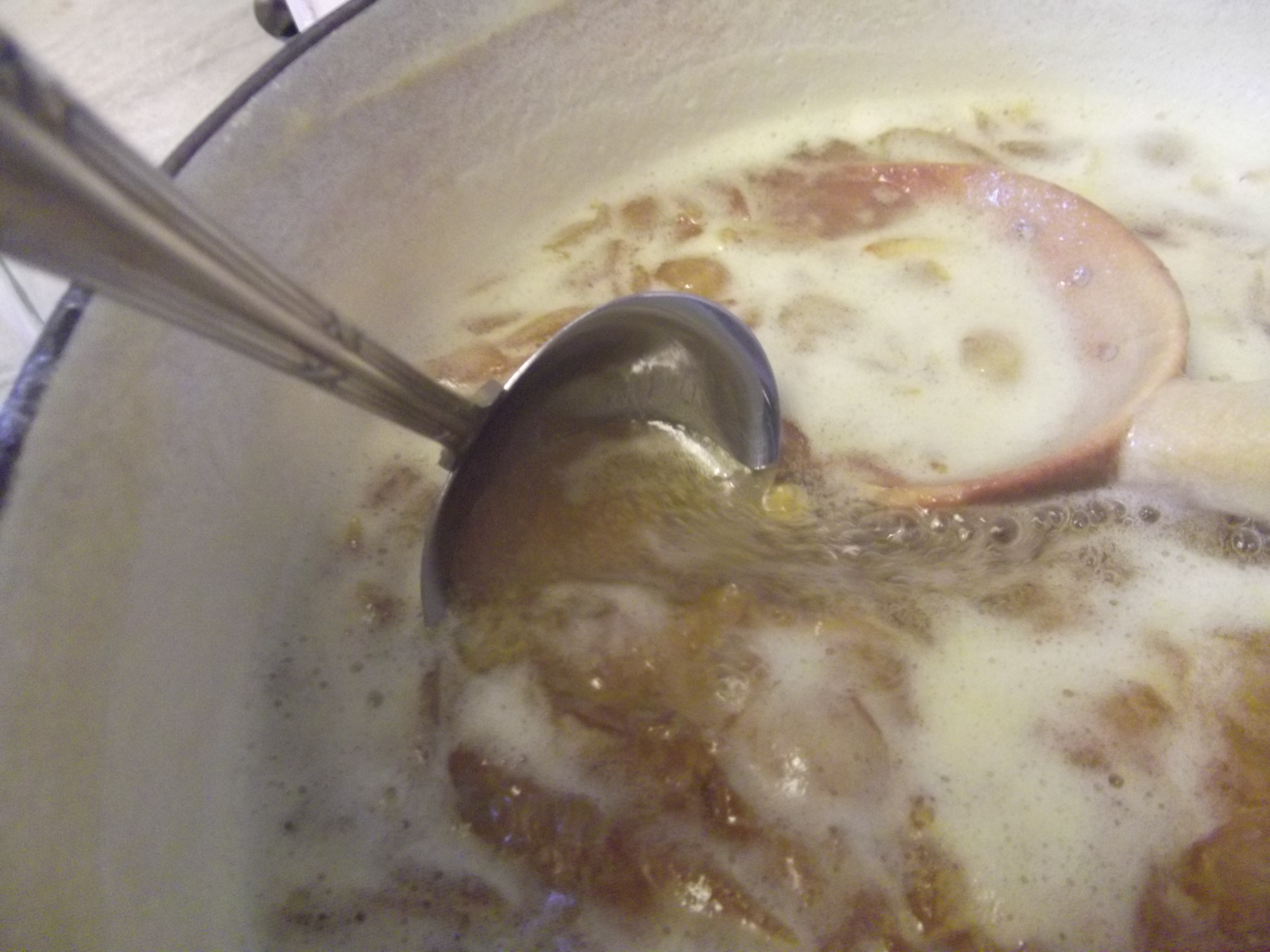 using a sauce ladle to ladle the jam -1.JPG