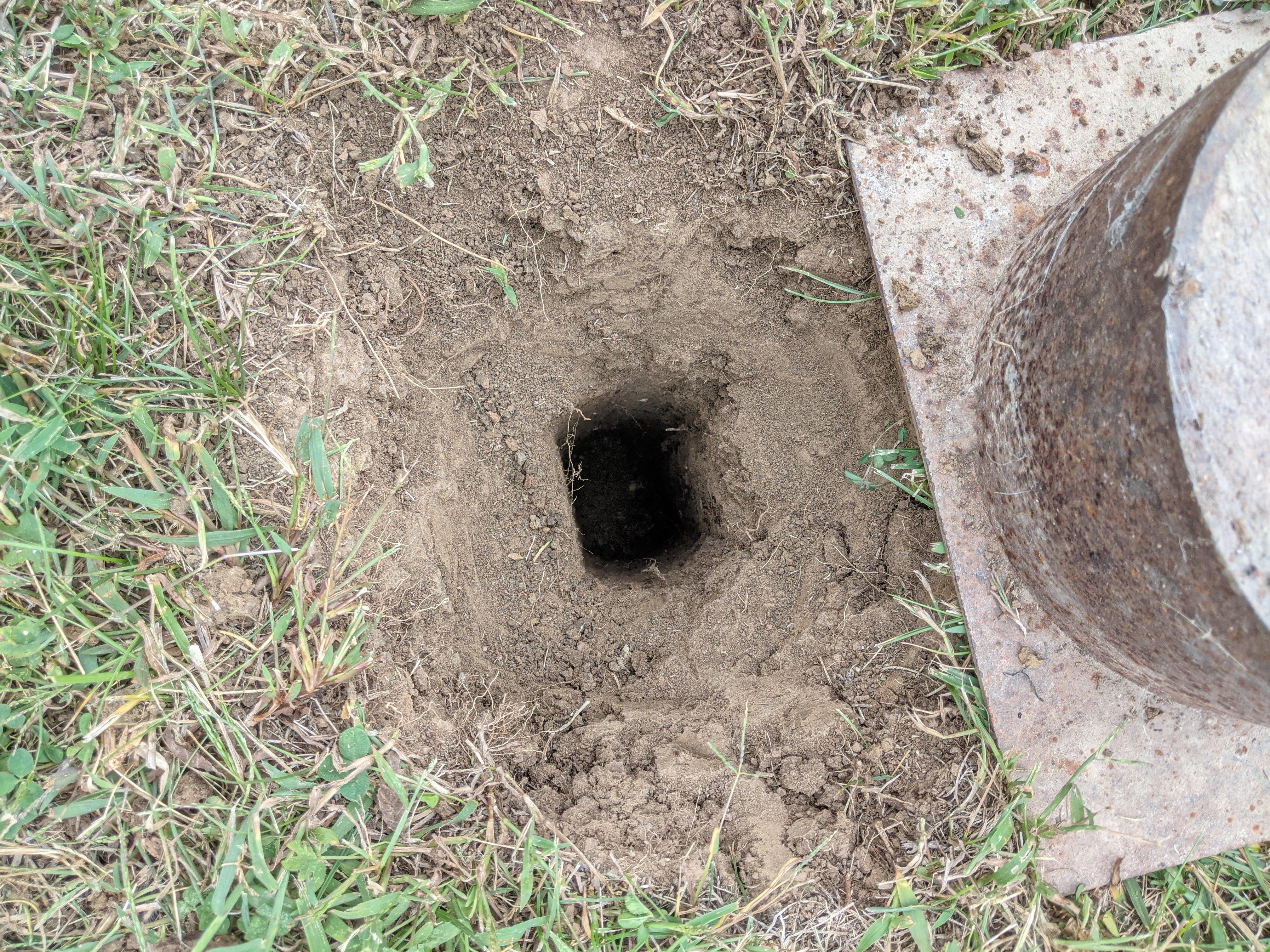 view of empty hole after pulling post.jpg