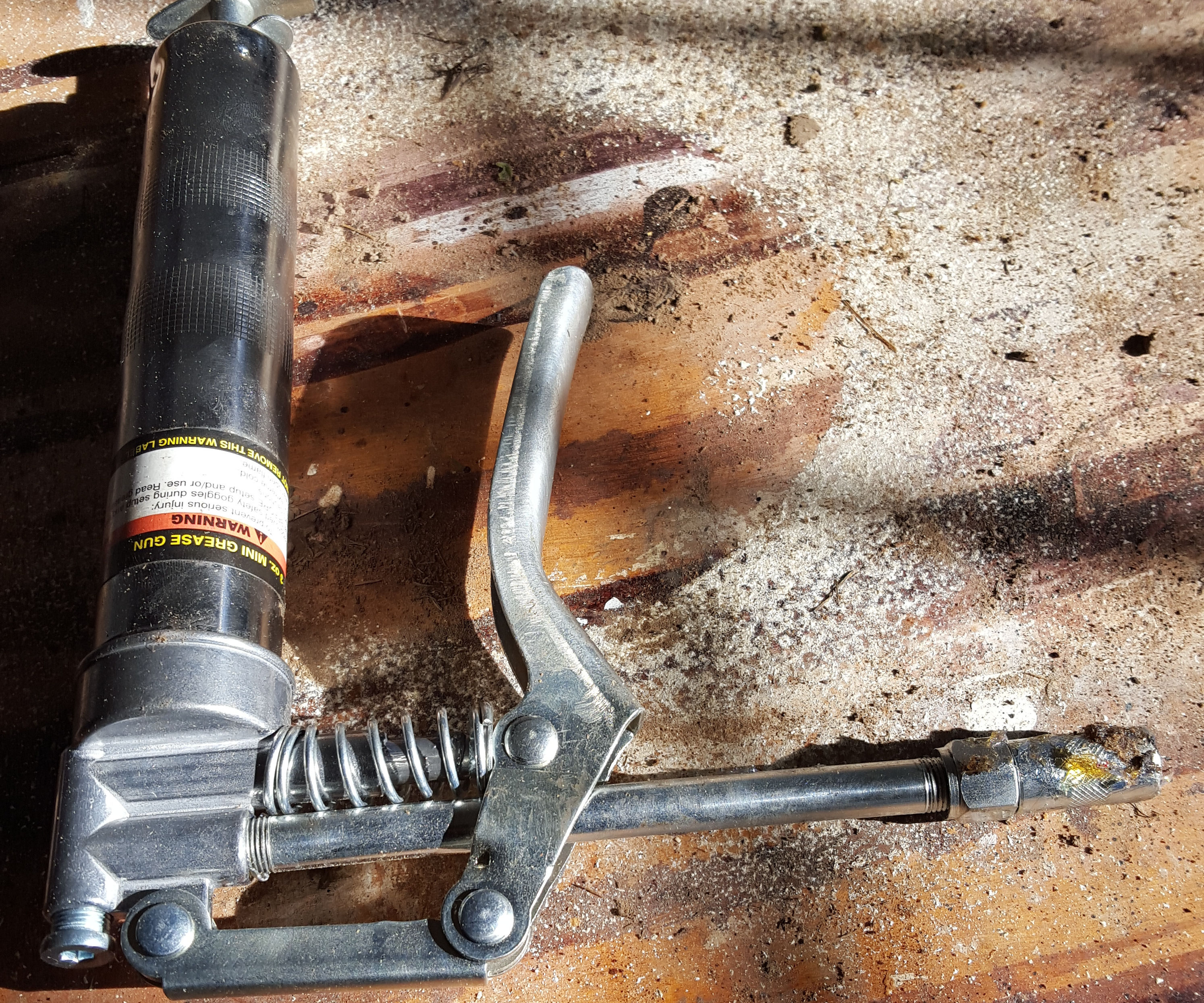 Storing a Grease Gun Without the Mess.