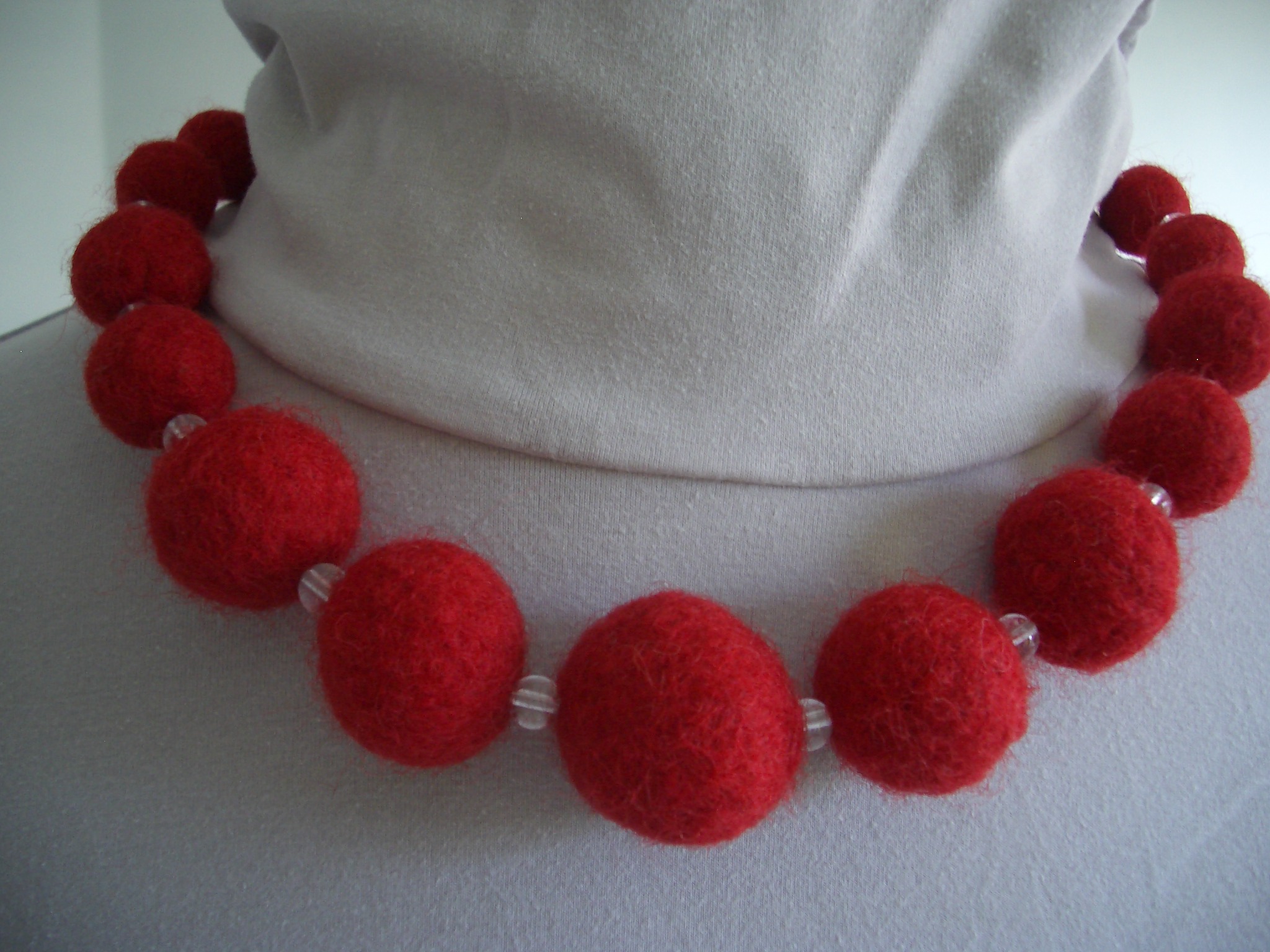 Felt balls from knitting wool for a chunky bead necklace