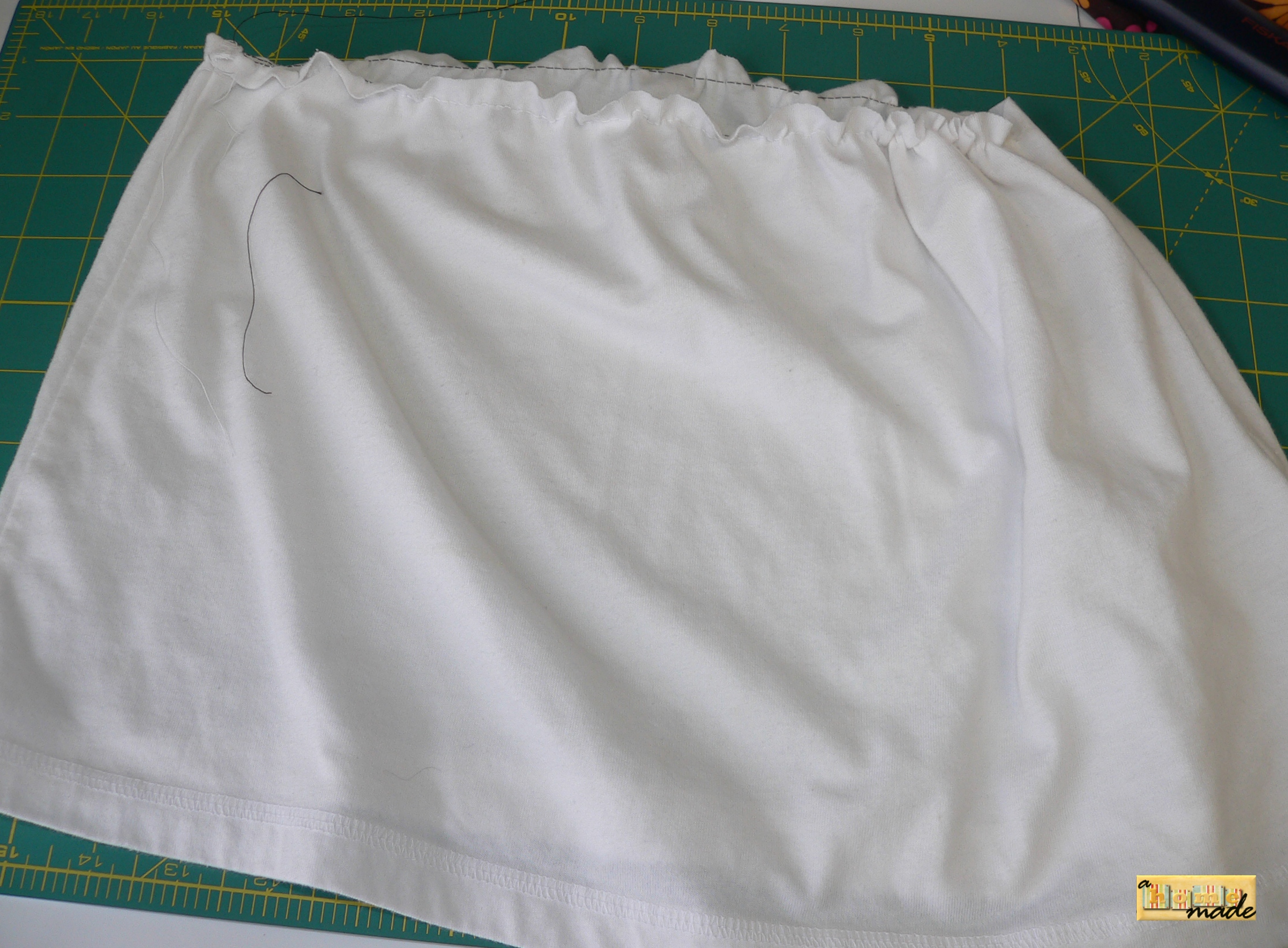 cut bottom of adult tee to desired length, gathering edge at top and gather to width of child's tee.JPG