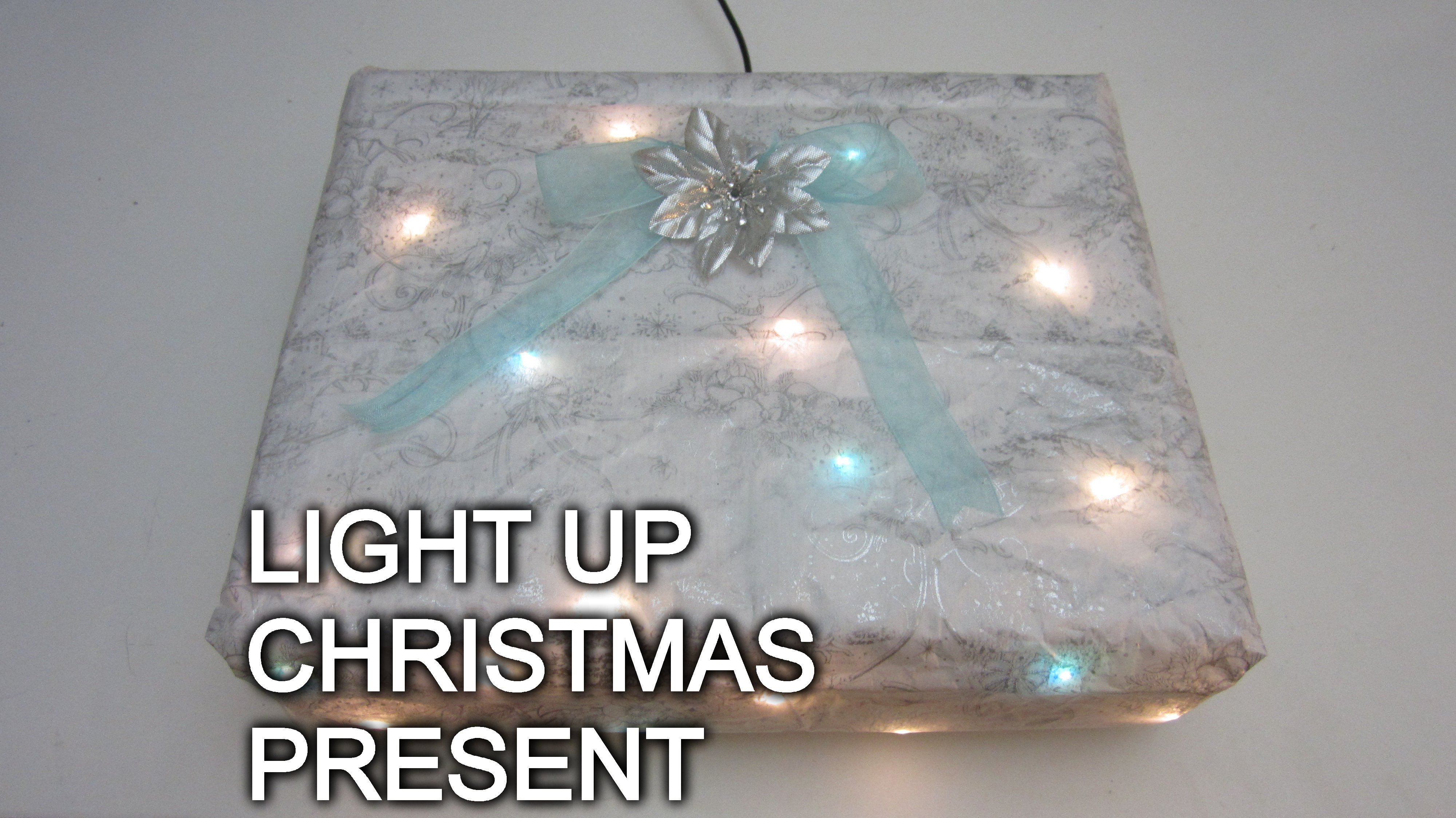 Christmas Present That Lights Up When You Put It Under the Tree