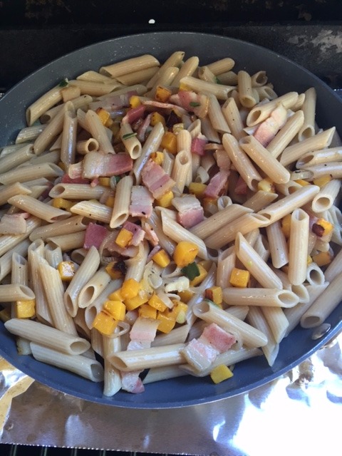 a large ceramic coated pan on the BBQ  making Gluten Free Rigate with Roasted Butternut Squash and Smoked Bacon.JPG