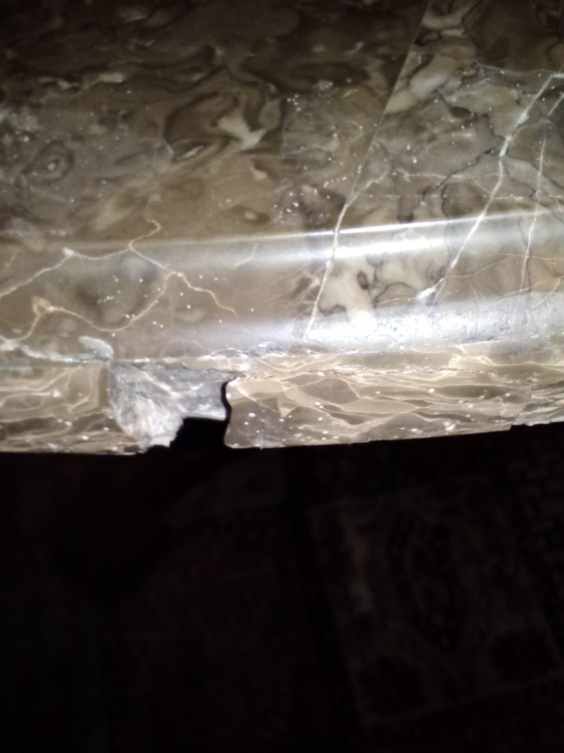 Fixing the Edge of a Chipped Marble Tabletop With Sugru