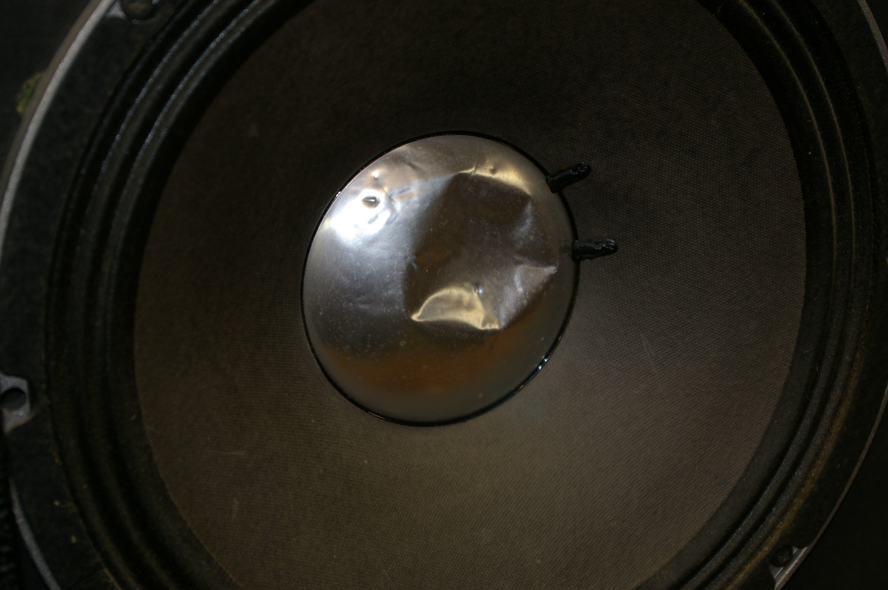 Fix a dented or inverted metal speaker dust cover