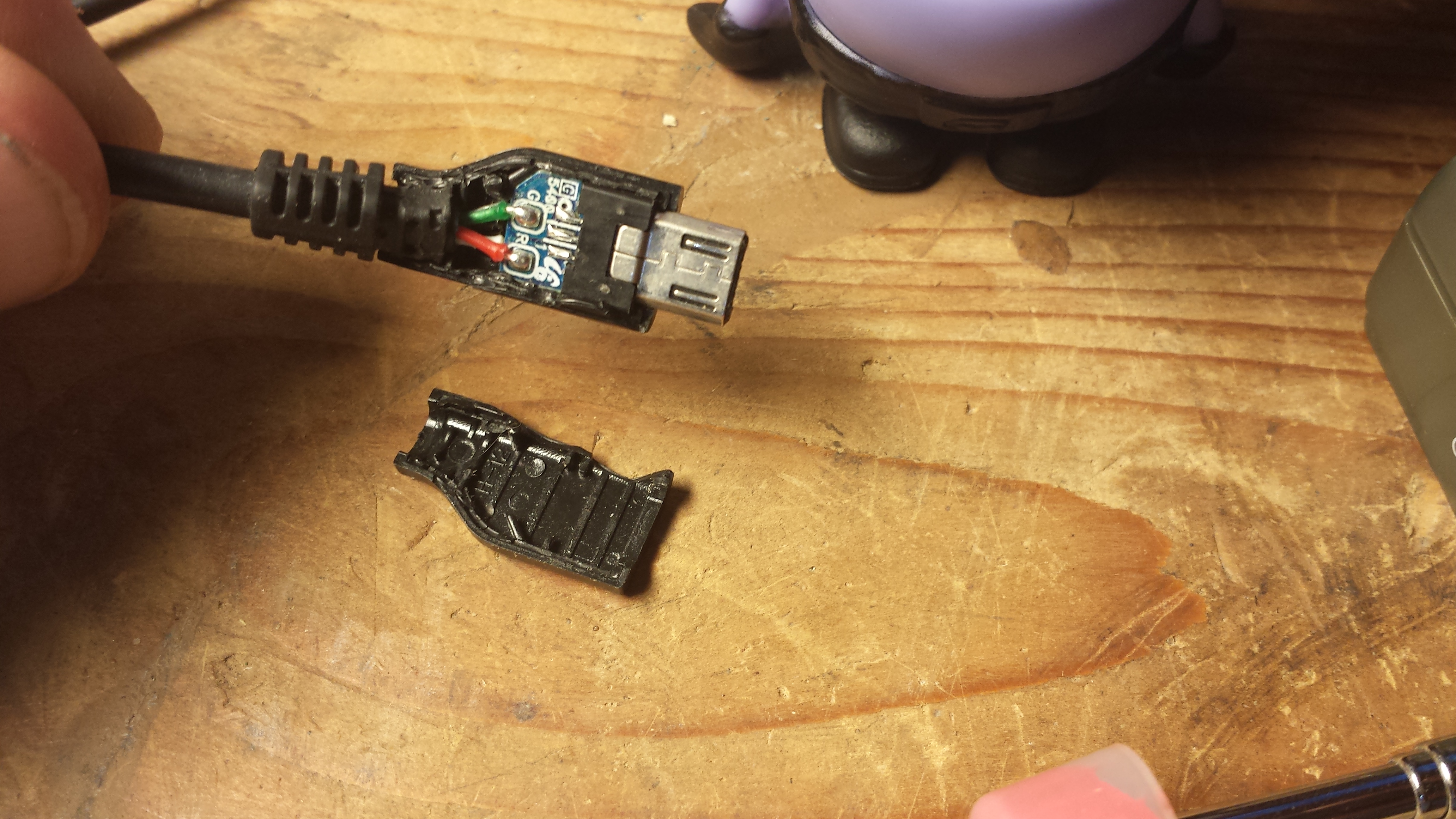 Reattach a USB charging cable housing cover with sugru