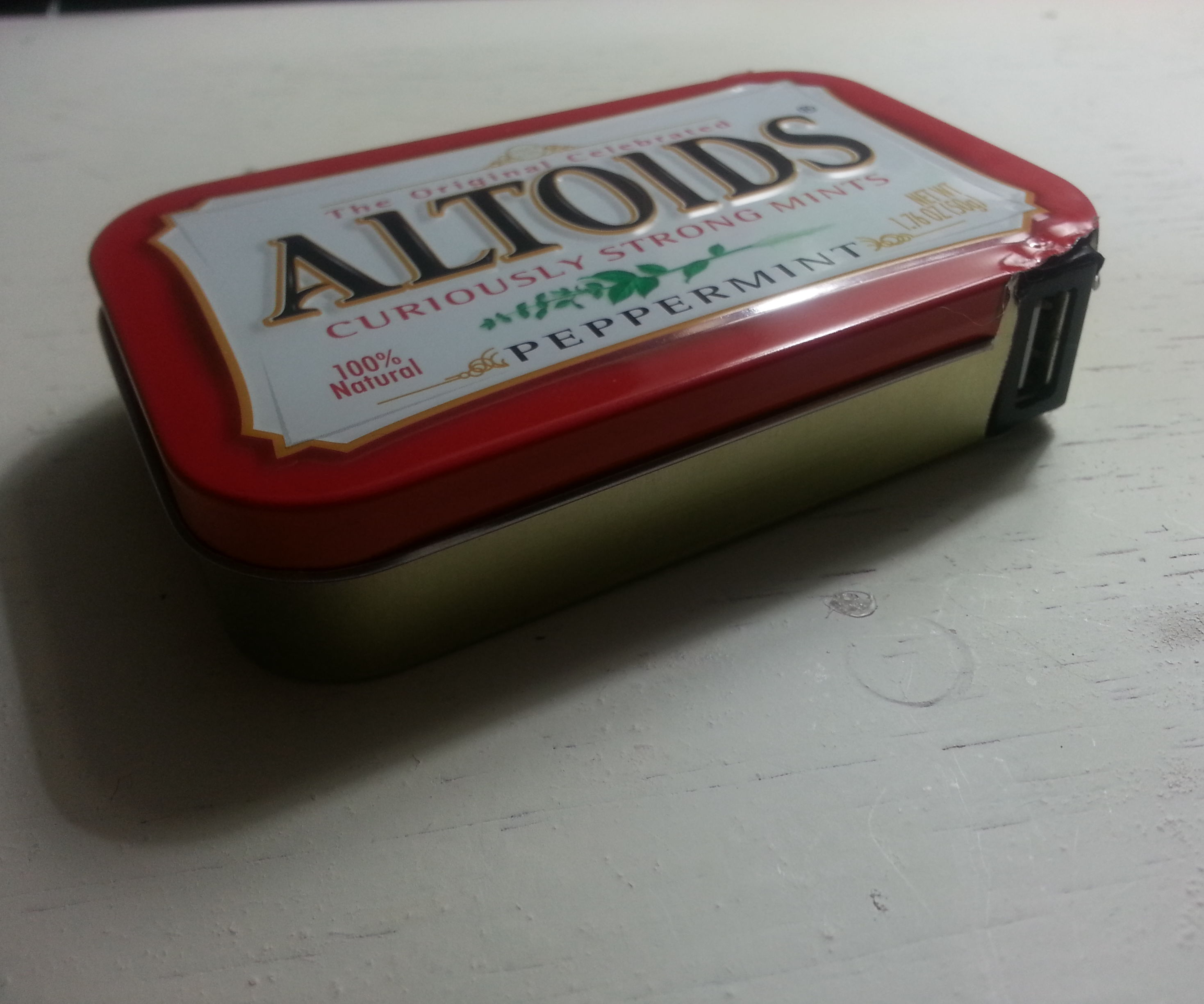 Hack together a powerful pocket USB charger. (6.6 amp hour battery)