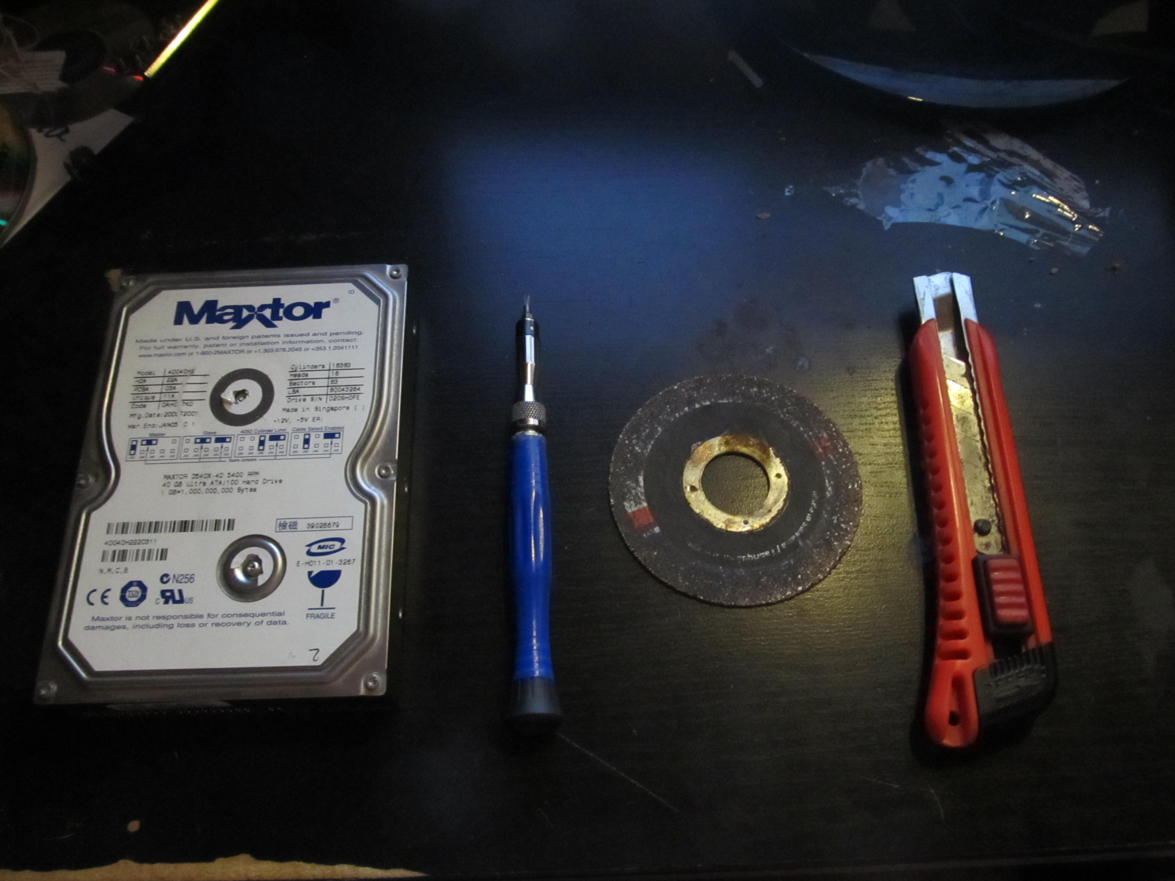 Hack a dead HDD and an angle grinder disk into a small tool emery wheel