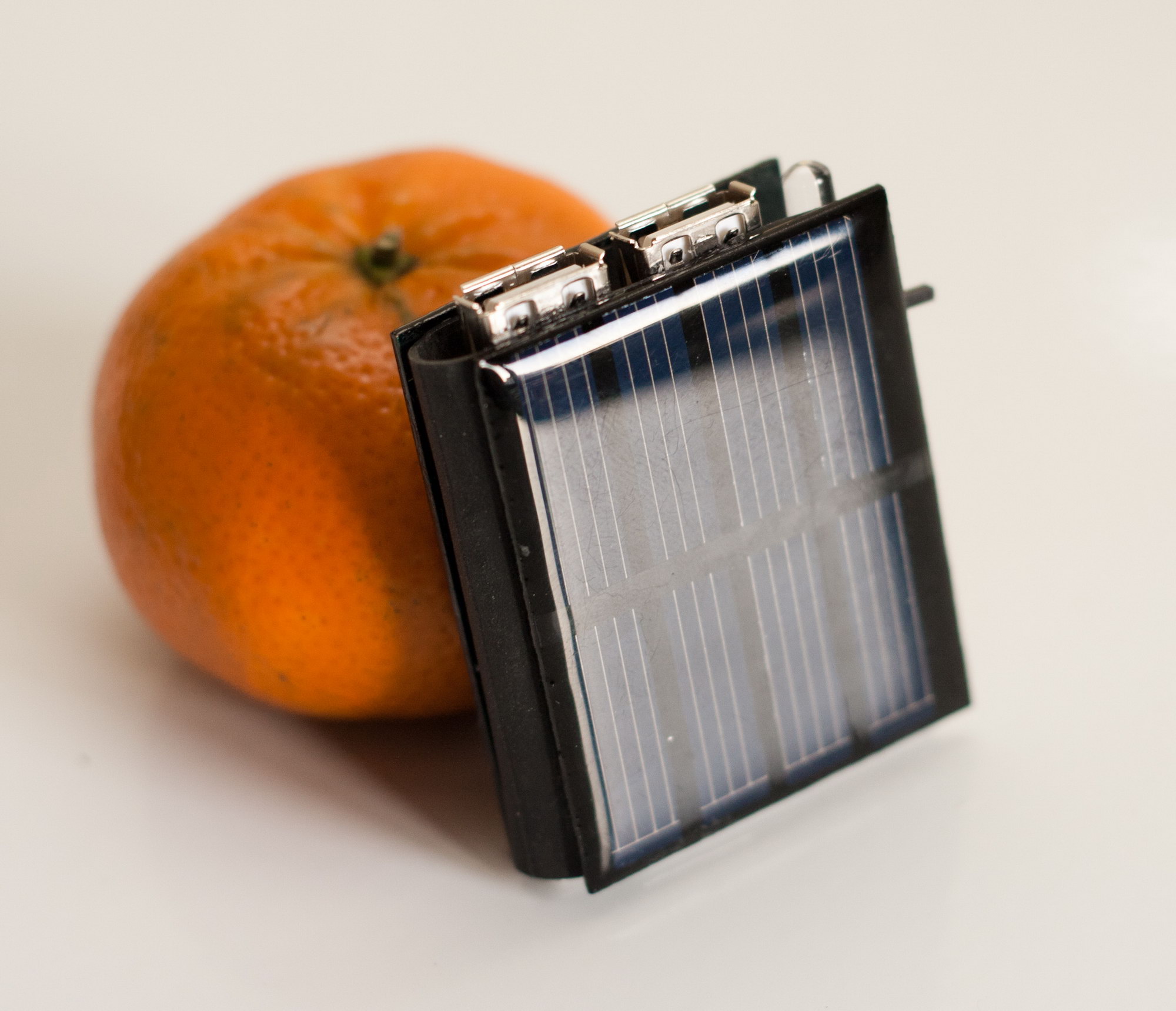 the "mini solar book", torch and charger