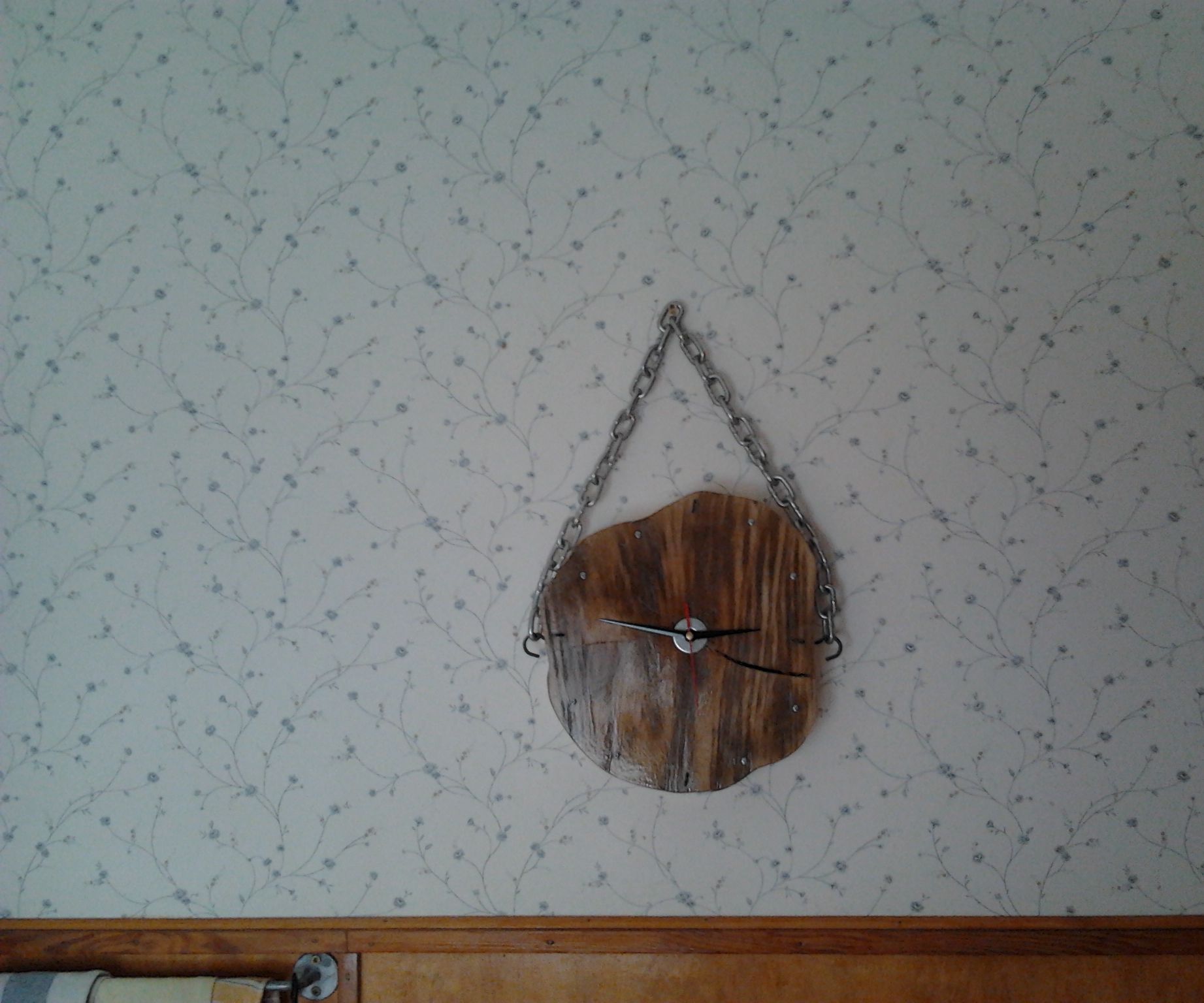 Handmade clock made of wood disc (rings)