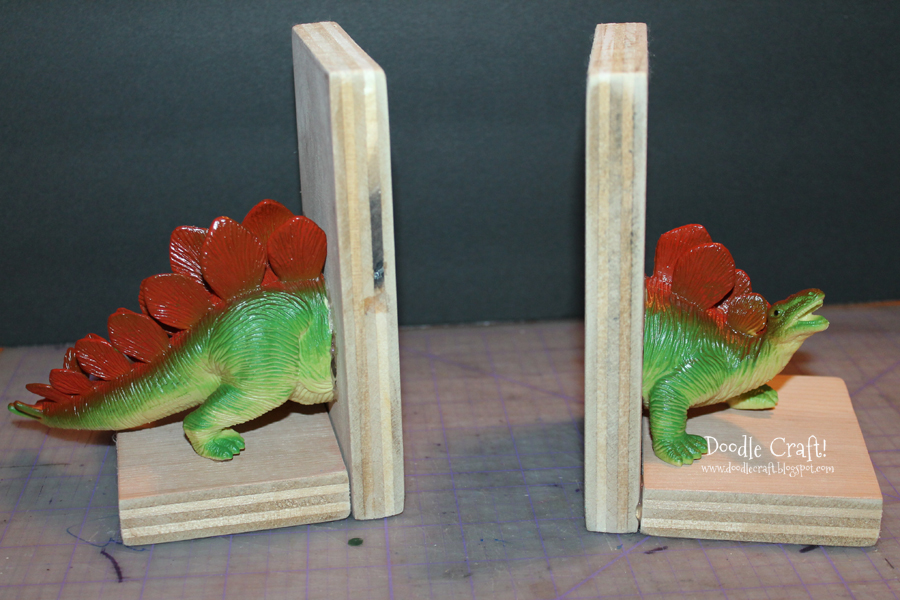 dinosaur toy book ends diy make your own teal aqua spray painted kids toys crafts activities projects t-rex stegosaurus toys plastic and wood upcycle (12).JPG