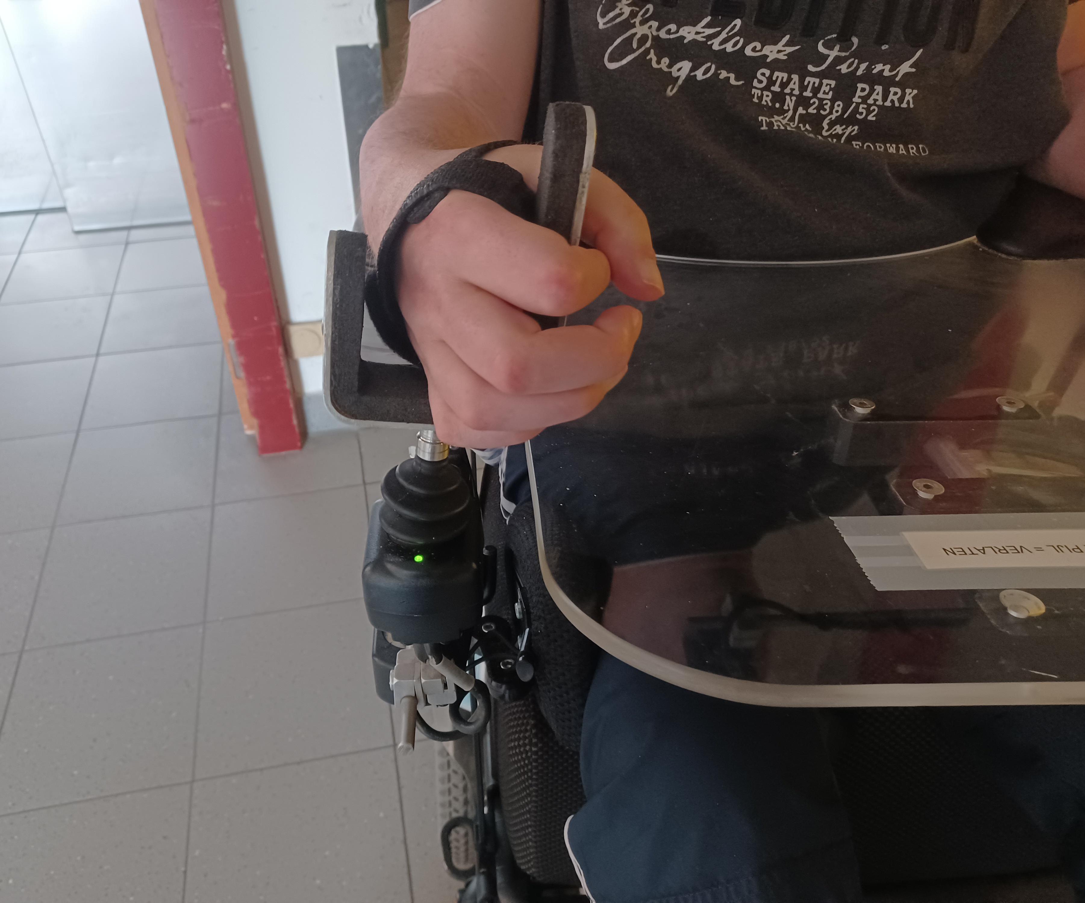 D4E1:  Hand Splint With Magnet and Joystick With Magnet for an Electric Wheelchair User