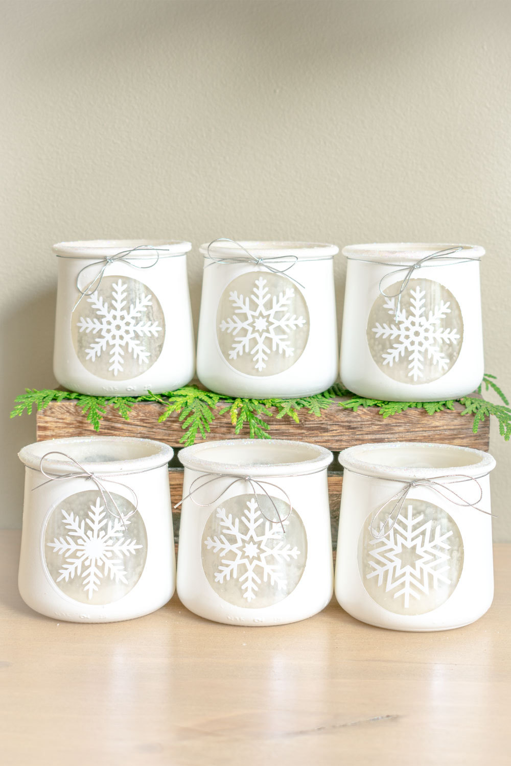 How-to-repurpose-Oui-Yogurt-Jars-to-beautiful-white-DIY-winter-votive-holders-with-spray-paint,-vinyl,-and-glitter-for-a-snowy-christmas-craft-or-table-centerpiece-18.jpg