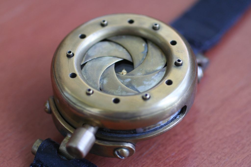 Steampunk Wristwatch With Mechanical Iris Cover. "TimEye".